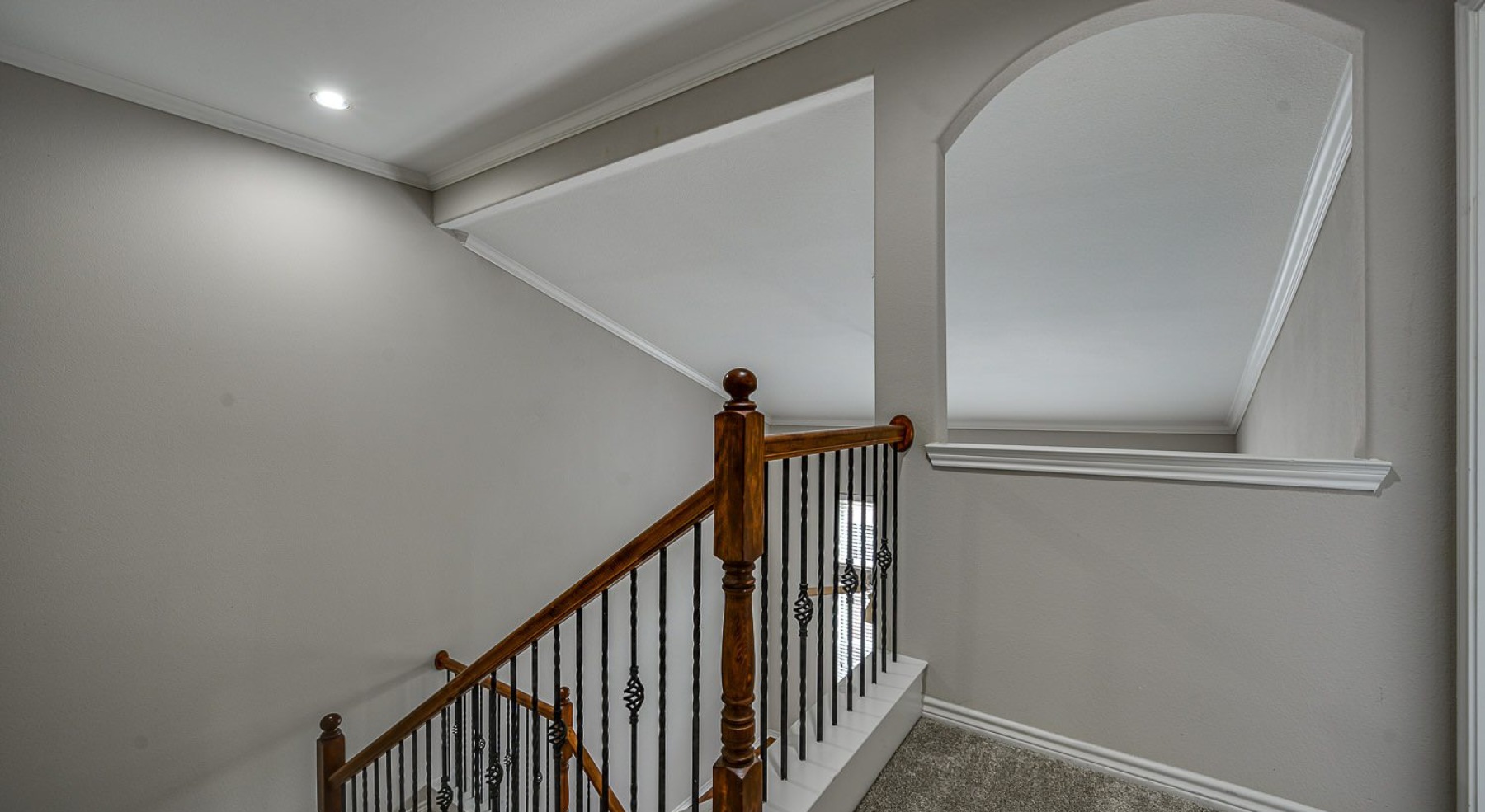 upstairs hallway with ample lighting
